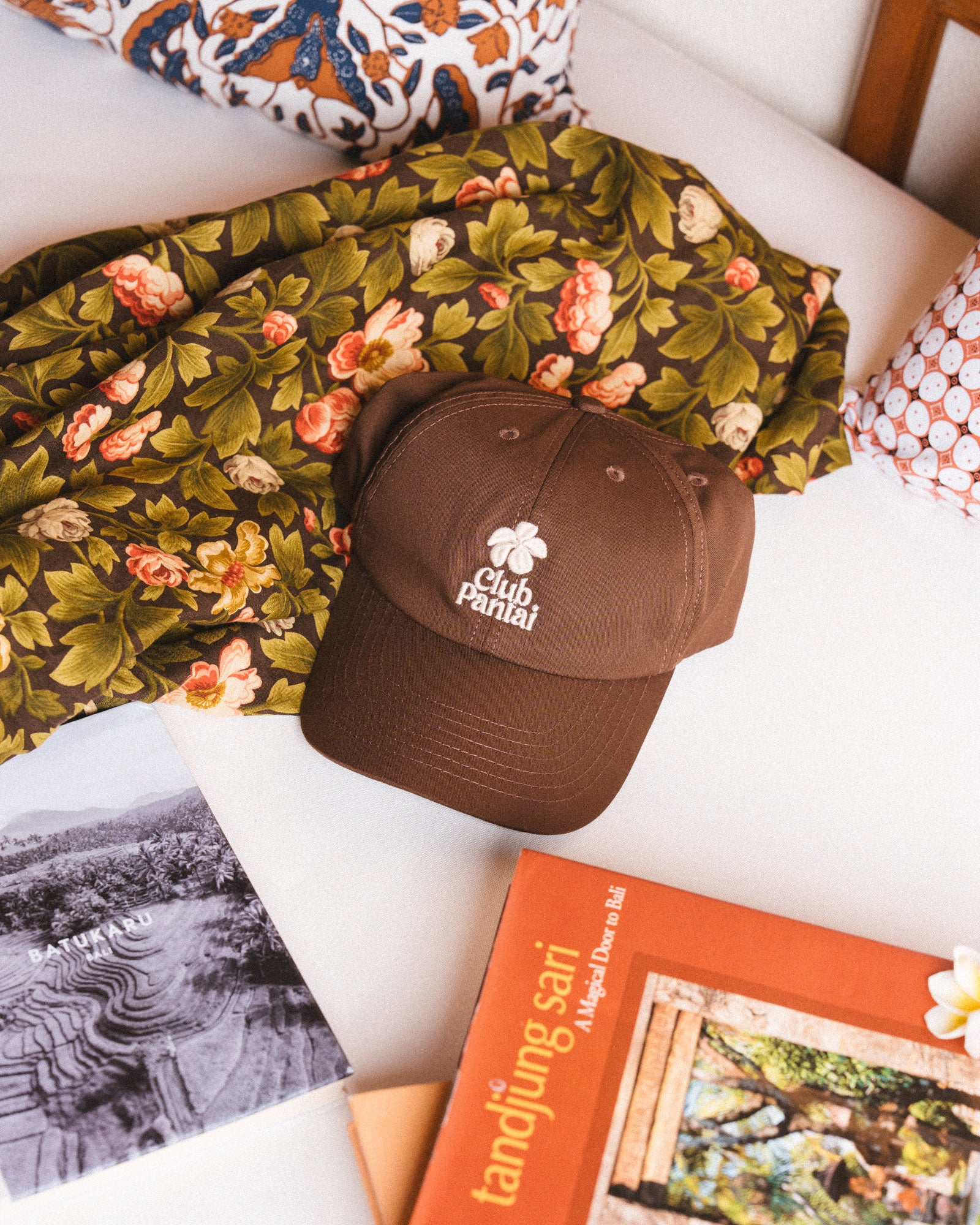 Brown cap with 'Club Pantai' logo