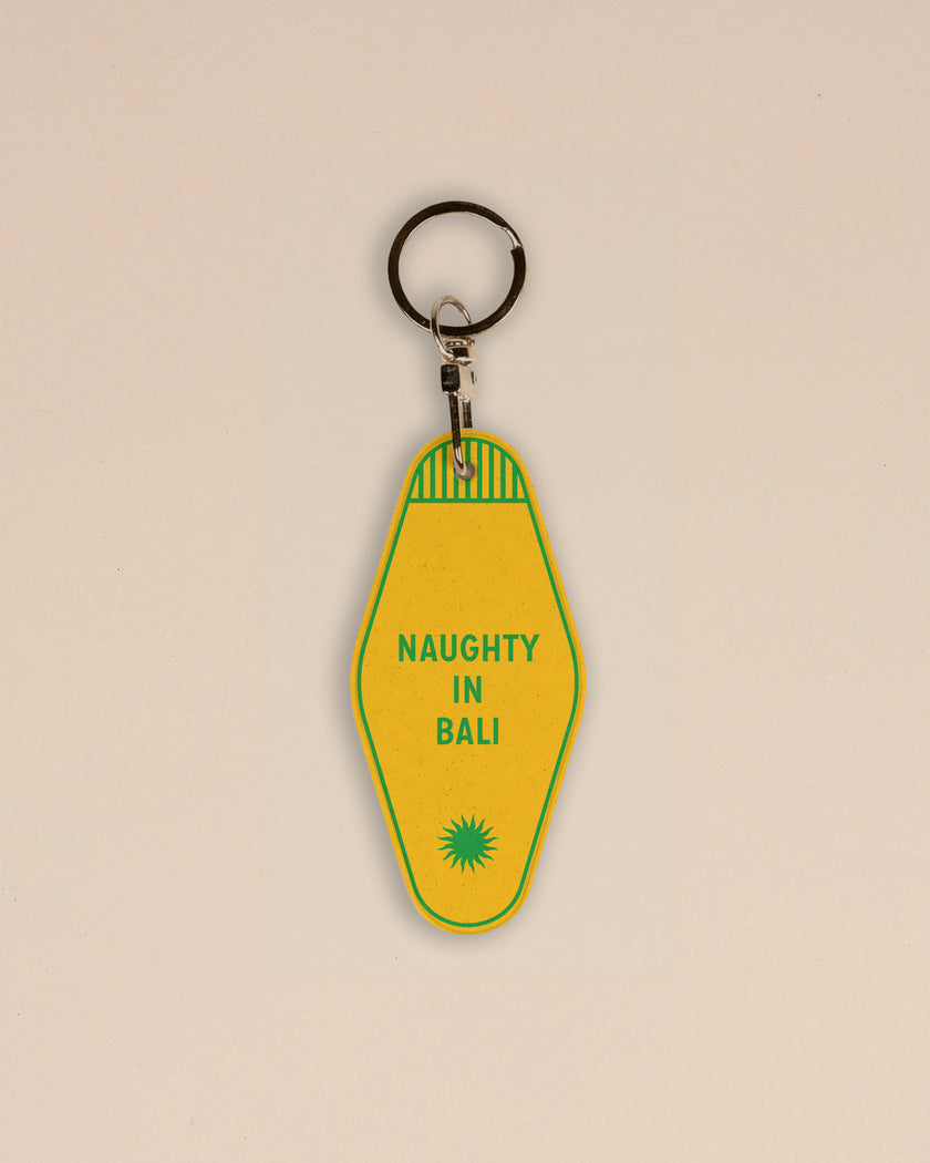 Yellow keychain Club Pantai with 'Naughty in Bali'