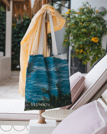 Club Pantai tote bag with a scenic design and 'ULUWATU' logo